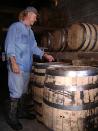 55-gallon oak barrels containing the fermenting cider