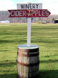 Sign pointing to Benton ciderworks and winery at entrance